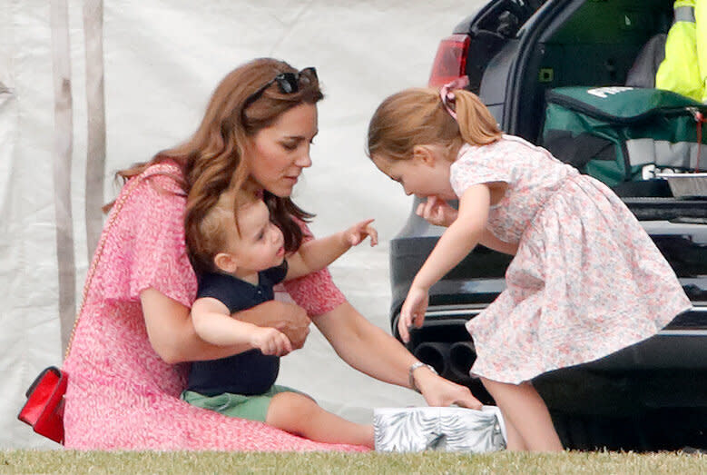 The Duchess of Cambridge, Prince Louis and Princess Charlotte attend the King Power Royal Charity Polo Match at Billingbear Polo Club on July 10, 2019 in Wokingham, England.