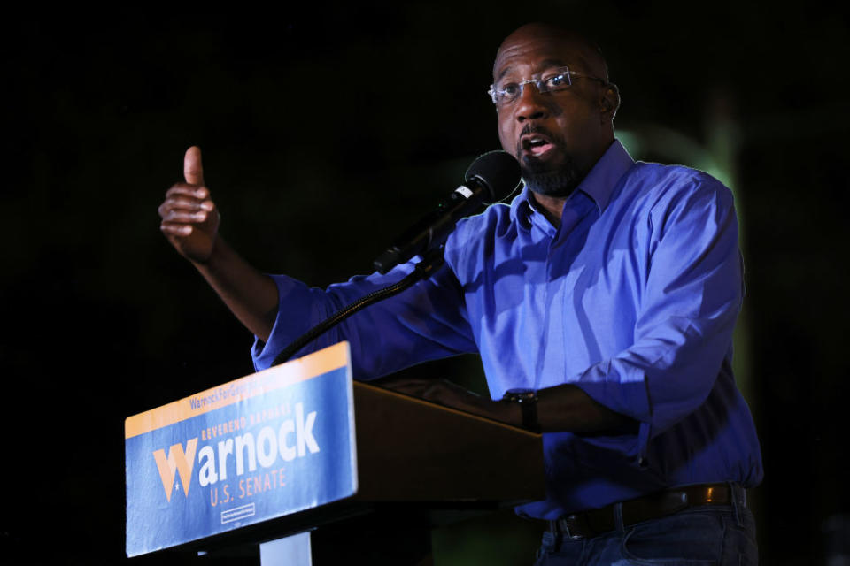 Sen. Raphael Warnock (D-GA) addresses supporters during a rally in the parking lot of Abundant Life Full Gospel on November 07, 2022 in Columbus, Georgia.<span class="copyright">Michael M. Santiago—Getty Images</span>