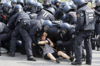 <p>Protesters clash with German police officers during the G-20 summit in Hamburg, Germany, July 7, 2017. (Photo: Massimo Percossi/EPA/REX/Shutterstock) </p>