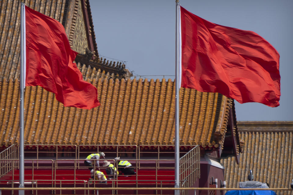 Workers prepare a raised seating area infront of Tiananmen Gate near Tiananmen Square in Beijing, Tuesday, June 22, 2021. Chinese authorities have closed Beijing's central Tiananmen Square to the public, eight days ahead of a major celebration being planned to mark the 100th anniversary of the founding of the ruling Communist Party. (AP Photo/Mark Schiefelbein)