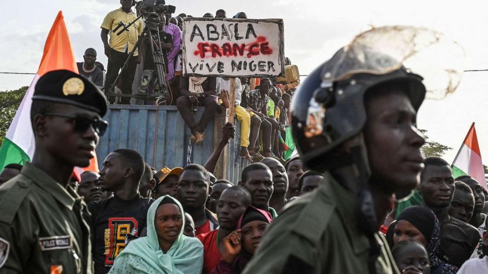 PHOTO: Supporters of Niger's National Council of Safeguard of the Homeland (CNSP) holds a placard as people protest ouside the Niger and French airbase to demand the departure of the French army from Niger, in Niamey on Sept. 16, 2023. (AFP via Getty Images)