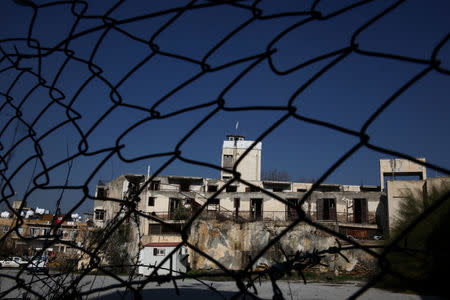 An abandoned building is seen inside the UN-controlled buffer zone in Nicosia, Cyprus January 18, 2017. REUTERS/Yiannis Kourtoglou