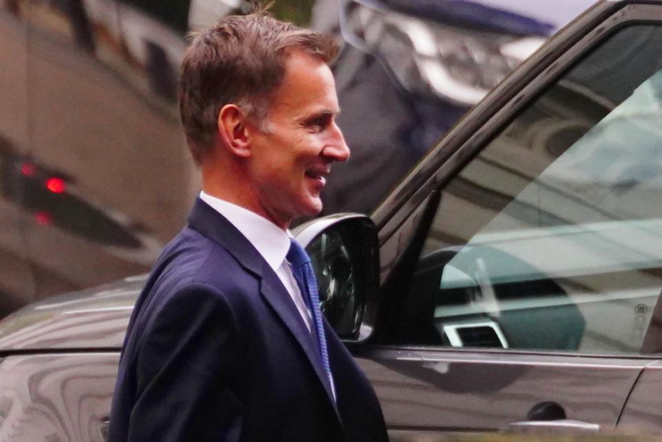 Jeremy Hunt seen getting into a car at the rear of Downing Street on Monday morning (PA)