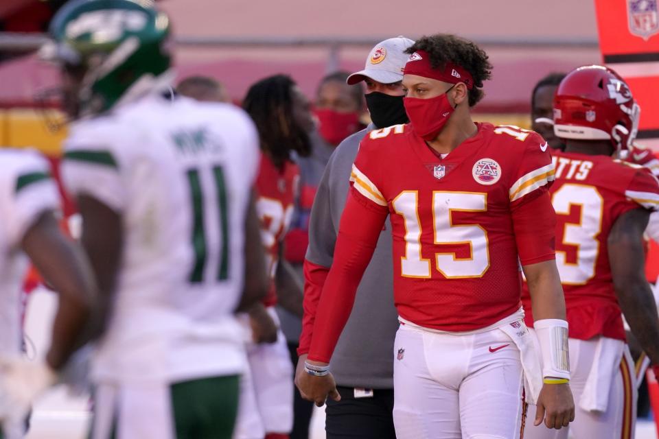 Kansas City Chiefs quarterback Patrick Mahomes (15) greets members and staff of the New York Jets after their NFL football game on Sunday, Nov. 1, 2020, in Kansas City, Mo. (AP Photo/Charlie Riedel)