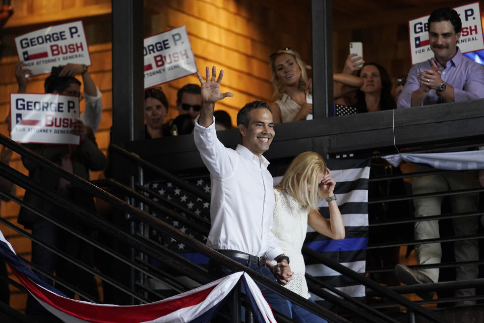 Texas Land Commissioner George P. Bush arrives for a kick-off rally with his wife Amanda to announced he will run for Texas Attorney General, Wednesday, June 2, 2021, in Austin, Texas. (AP Photo/Eric Gay)