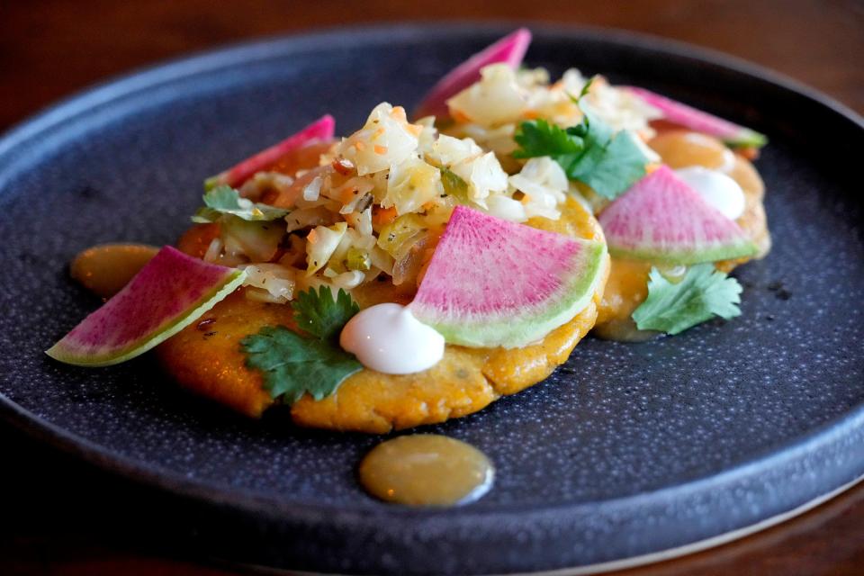 Odd Duck serves an ever-changing menu of globally inspired dishes, like these huitlacoche, chihuahua and goat cheese pupusas with curtido viejo, Odd Duck hot sauce, crema, cilantro and radish.