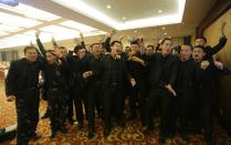 Students at Tianjiao Special Guard/Security Consultant sing during a group dinner on the outskirts of Beijing December 14, 2013. Former Chinese soldier Chen Yongqing has big ambitions for his bodyguard training school Tianjiao, which he says is China's first professional academy to train former soldiers and others as personal security guards. Chen charges 500,000 yuan ($82,400) a year for each protector as China's rich and famous look to bolster their safety and sense of importance. Picture taken December 14, 2013. REUTERS/Jason Lee (CHINA - Tags: BUSINESS SOCIETY) ATTENTION EDITORS: PICTURE 23 OF 26 FOR PACKAGE 'CHINA'S BODYGUARD SCHOOL'