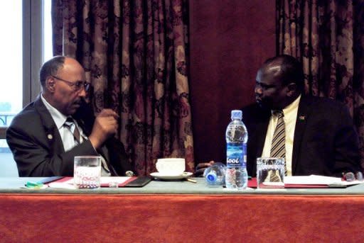 Sudan’s defence minister, Abdelrahim Mohamed Hussein (left) speaks with South Sudan's chief negotiator Pagan Amum during African Union-led peace talks in Addis Ababa on July 5. South Sudan set out Monday a proposed deal with rival Sudan, offering an increased oil transit fee offer, an $8.2 billion financial support package and demanding a referendum on disputed Abyei