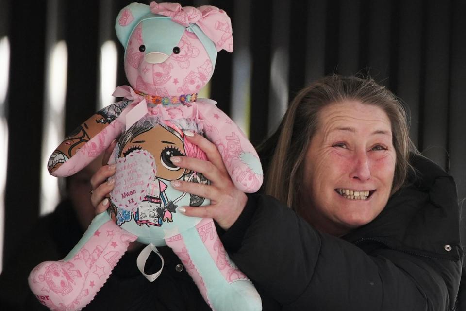 Cheryl Korbel, mother of nine-year-old Olivia Pratt-Korbel, holding a teddy bear outside Manchester Crown Court (PA)