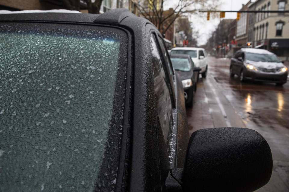 Ice blankets a windshield in downtown Kalamazoo, Mich. on Tuesday, Jan. 22, 2019. Icy roadways has led to crashes and prompted some school districts to close for the day Wednesday. (Joel Bissell/Kalamazoo Gazette via AP)