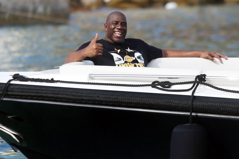 <p>Magic Johnson smiles as he soaks up the sun on a superyacht in Croatia on Wednesday.</p>