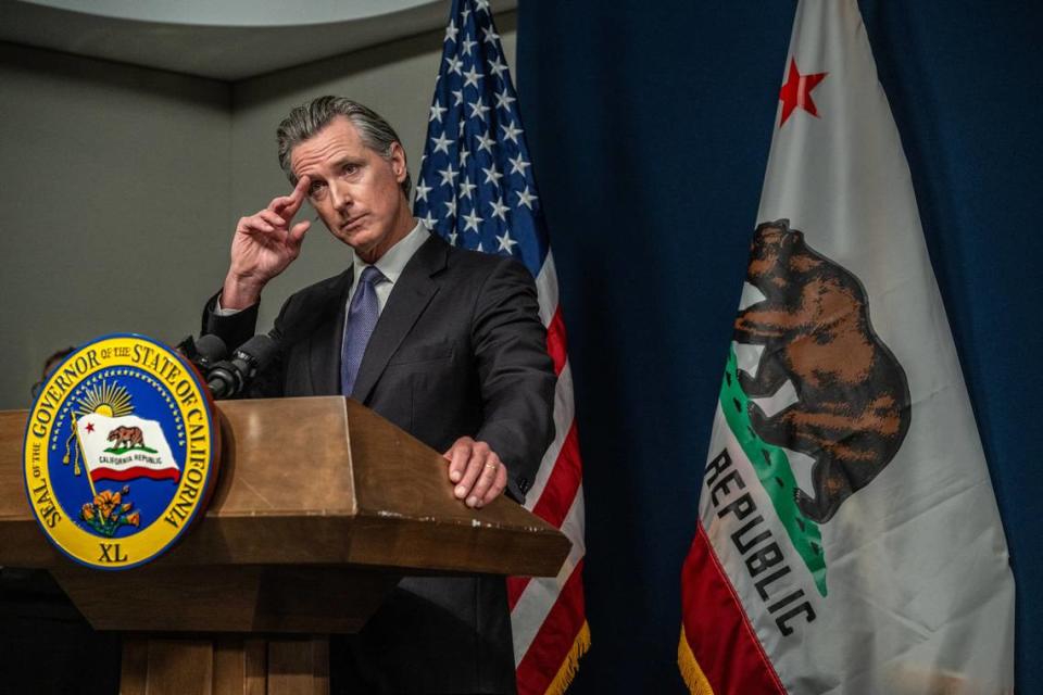 California Gov. Gavin Newsom listens during a news conference after signing bills in July. Lawmakers passed bills designed to bolster his plans to address mental health and homeless issues through a ballot measure in March.