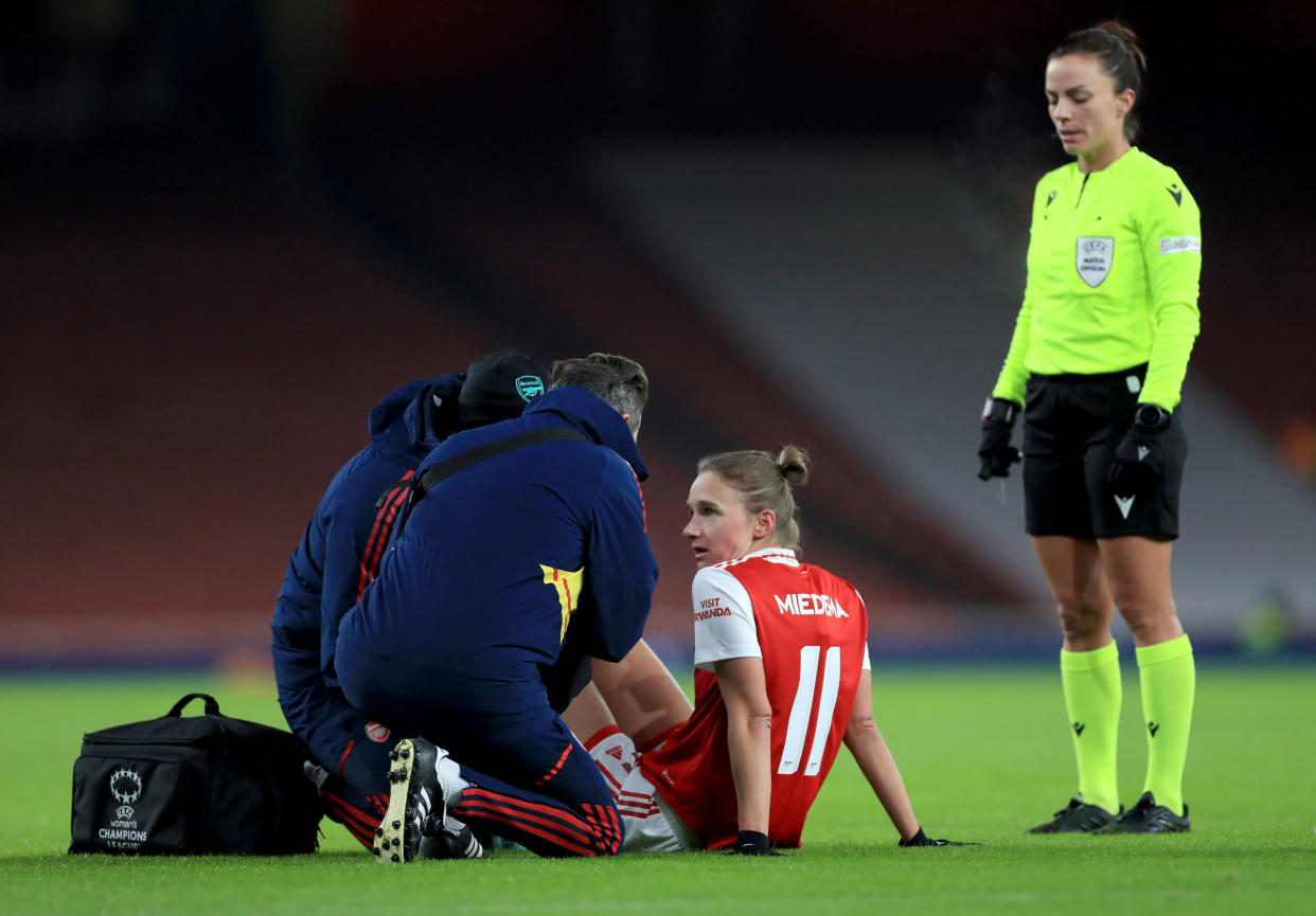 Vivianne Miedema receives medical attention during a UEFA Women’s Champions League match