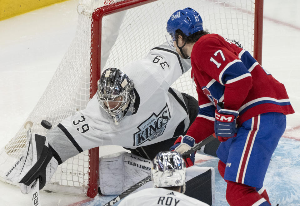 Los Angeles Kings goaltender Cam Talbot (39) makes a save against Montreal Canadiens' Josh Anderson (17) during the third period of an NHL hockey game Thursday, Dec. 7, 2023, in Montreal. (Christinne Muschi/The Canadian Press via AP)