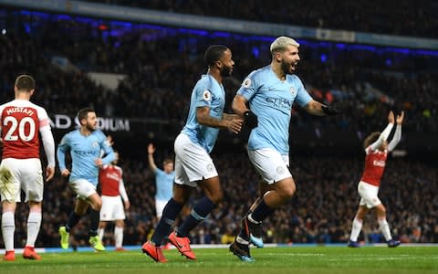  Manchester City striker Sergio Aguero (r) celebrates with Raheem Sterling after scoring his hat trick goal despite the efforts of Arsenal goalkeeper Bernd Leno and Laurent Koscielny during the Premier League match between Manchester City and Arsenal FC at Etihad Stadium - Credit: Getty images