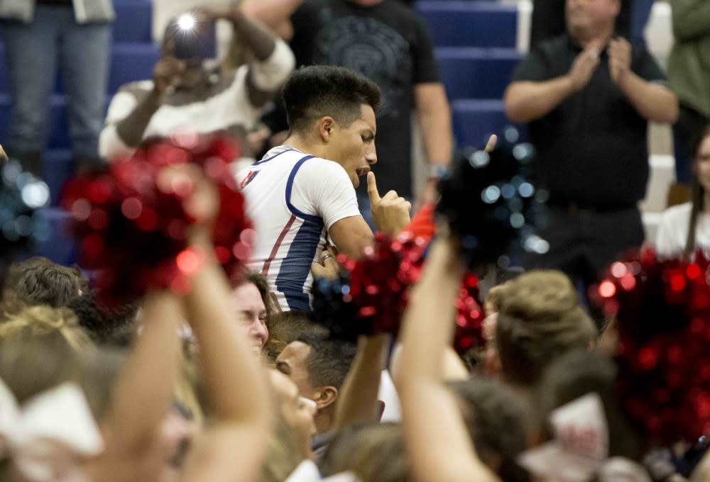 Jojo Rincon gets carried off the court after knocking down a game-winning shot from halfcourt. (via Jacob Stanek/West Valley Preps)