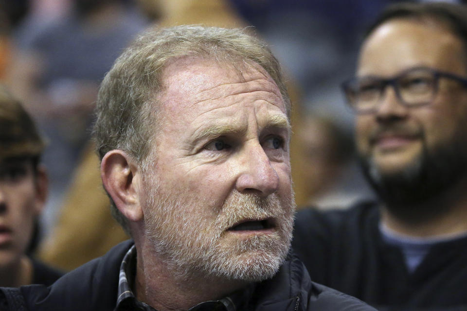 FILE - Phoenix Suns owner Robert Sarver watches the team play against the Memphis Grizzlies during the second half of an NBA basketball game Dec. 11, 2019, in Phoenix. Hardly a day passed in 2022 when a headline running across the ticker on ESPN would have been fitting on CNN or Fox Business. The intersection between sports and real life ranged from toxic workplace environments, alleged sexual misconduct, sportswashing, cryptocurrency, transgender sports and the COVID-19 pandemic. (AP Photo/Ross D. Franklin, File)