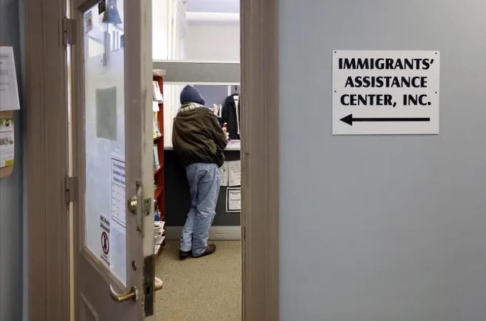 In this file photo, a man waits at the counter of the Immigrants' Assistance Center in New Bedford. IAC President Helena DaSilva Hughes says she's been fielding local inquiries on the order approved in January that allows U.S. entry by people of Nicaragua, Venezuela, Cuba and Haiti under temporary protected status, or TPS, also known as advance parole. The order comes as many from those countries look to flee political turmoil.
