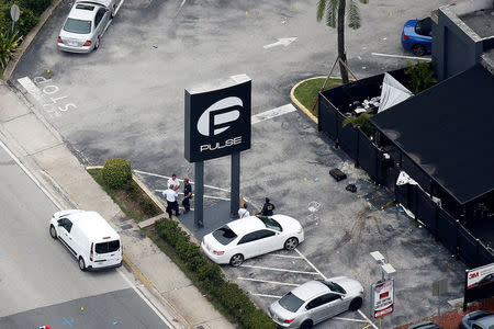 File Photo: Investigators work the scene following a mass shooting at the Pulse gay nightclub in Orlando Florida, U.S. June 12, 2016. REUTERS/Carlo Allegri/File Photo