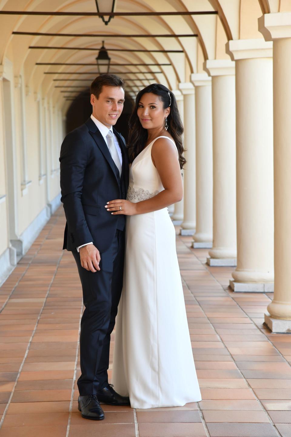 Marie Chevallier and Louis Ducruet after the civil ceremony. Marie is wearing Rosa Clara and Louis is wearing a navy suit made by the Italian house Carlo Pignatelli.