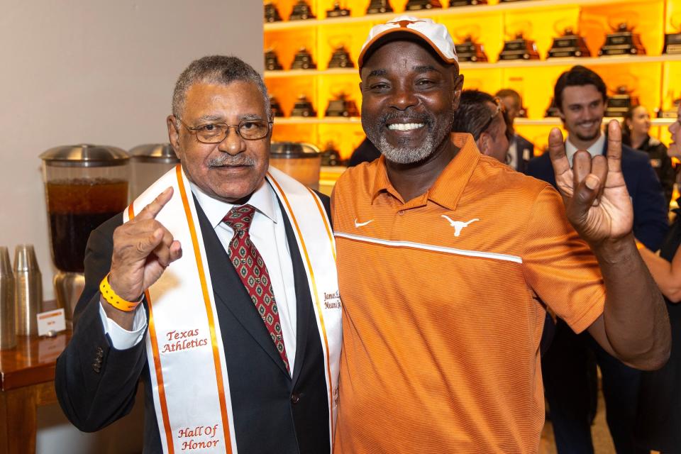 Texas Hall of Honor inductee James Means Jr. poses with current track and field coach Edrick Floréal last Friday. "You're talking about somebody that actually accomplished something that took so long to overcome," Floréal said.