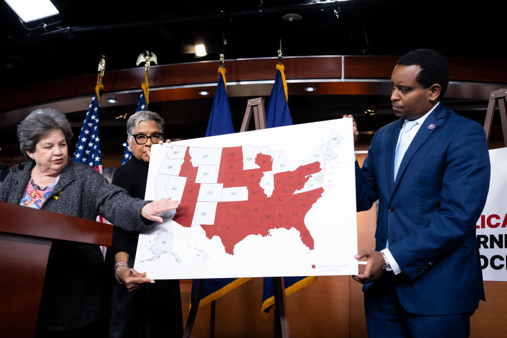  Rep. Lois Frankel, D-Fla., left, points out states with restricted reproductive rights as Rep. Joyce Beatty, D-Ohio, and Rep. Joe Neguse, D-Colo., hold the map during a news conference on reproductive rights in the U.S. Capitol on Wednesday, May 8, 2024. 