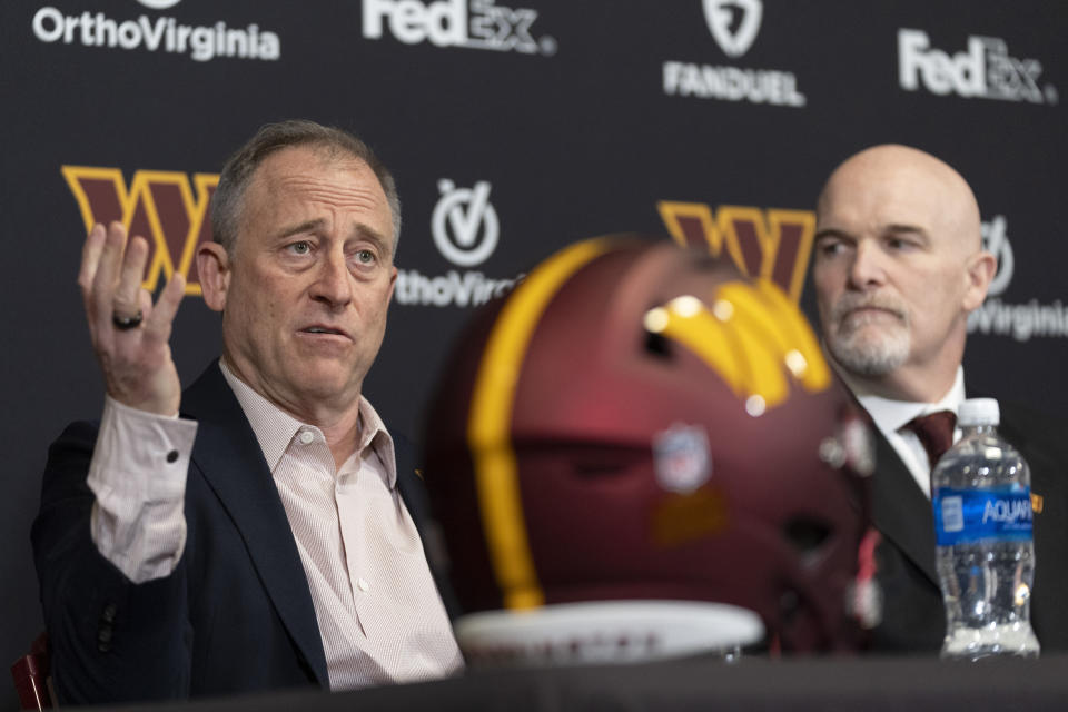 Washington Commanders managing partner Josh Harris, left, sits with the NFL football team's new head coach Dan Quinn, right, during a news conference at Commanders Park in Ashburn, Va., Monday, Feb. 5, 2024. (AP Photo/Manuel Balce Ceneta)