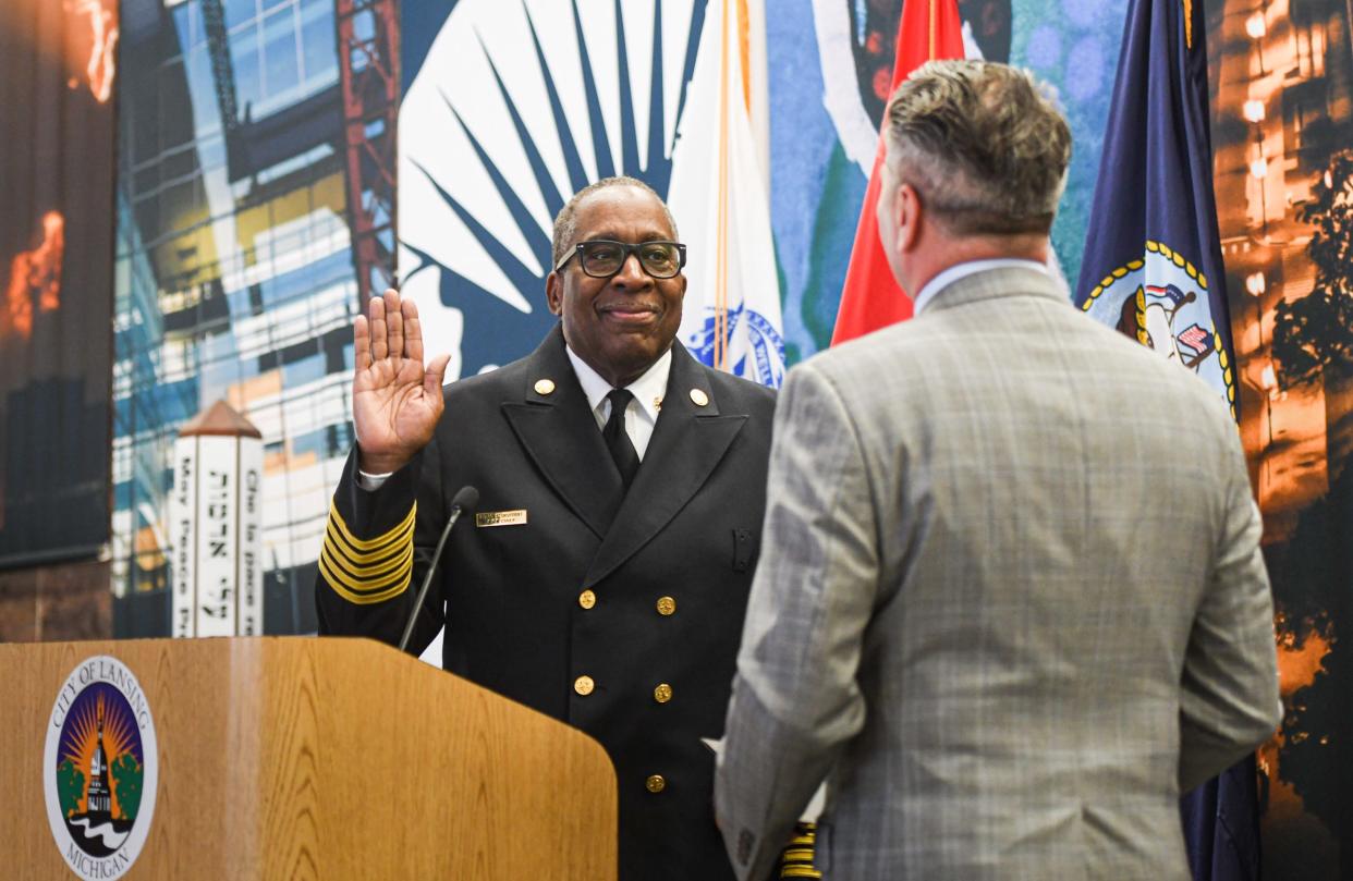 Lansing City Clerk Chris Swope swears in new Lansing Fire Chief Brian Sturdivant Wednesday, June 8, 2022, at Lansing City Hall.