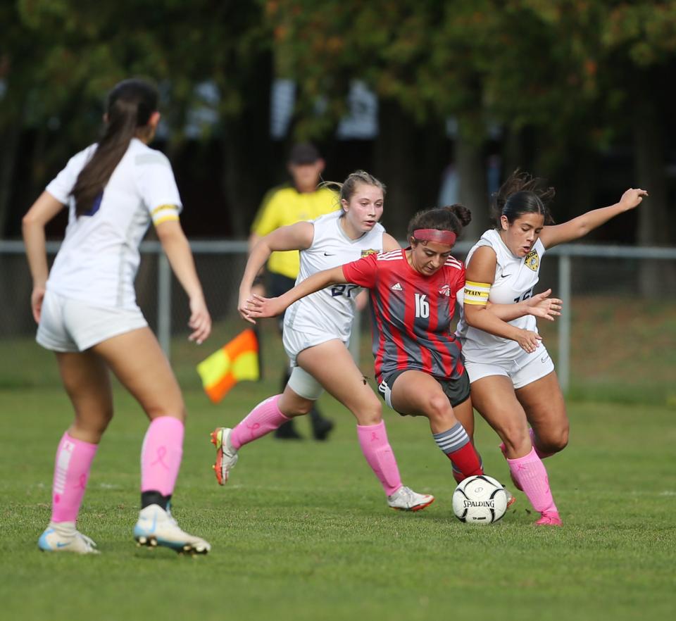 Red Hook's Ani Safaryan battles for possession between two Beacon defenders during a Section 9 Class A girls soccer semifinal on Oct. 25, 2023.