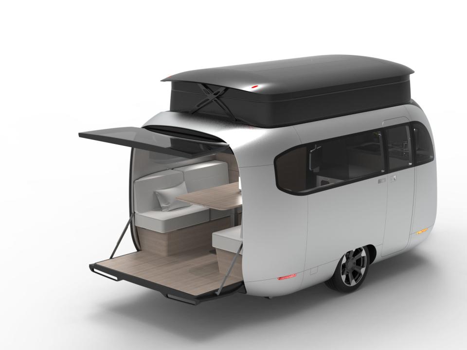 A rendering of the Airstream Studio F. A. Porsche Concept Travel Trailer's pop-top roof with the rear hatch open.