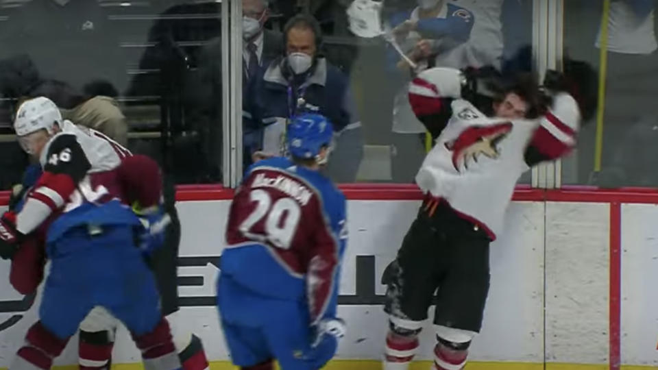 Nathan MacKinnon chucks his helmet at Connor Garland. 