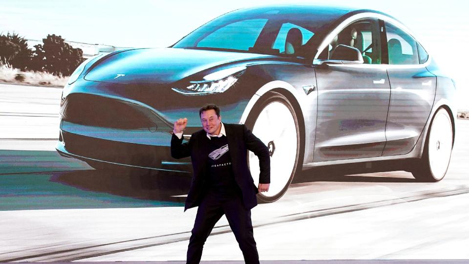 Tesla Inc CEO Elon Musk dances onstage during a delivery event for Tesla China-made Model 3 cars in Shanghai