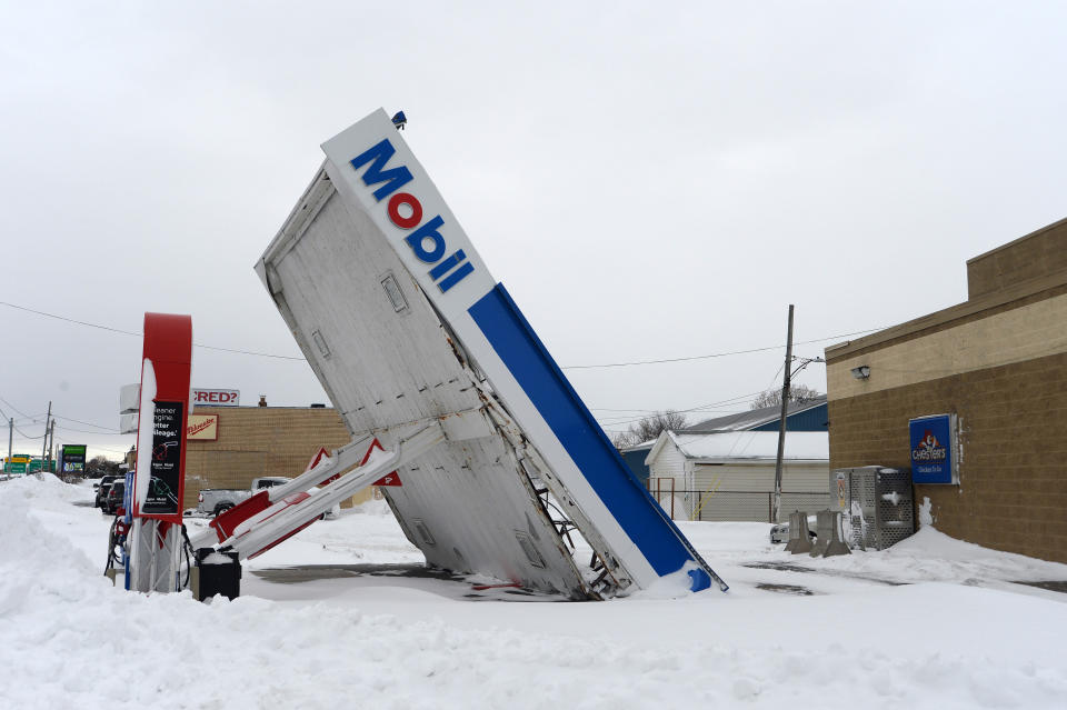 A gas station canopy lies on its side after high winds and heavy snow along Lake Shore Boulevard on Dec. 27, 2022, in Lackawanna, New York, a suburb of Buffalo.