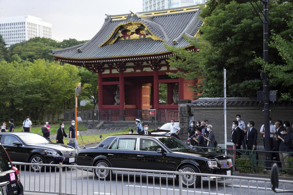 A car carrying Japan's Prime Minister Fumio Kishida arrives for the funeral wake of former Prime Minister Shinzo Abe, at Zojoji temple Monday, July 11, 2022, in Tokyo. (AP Photo/Eugene Hoshiko)