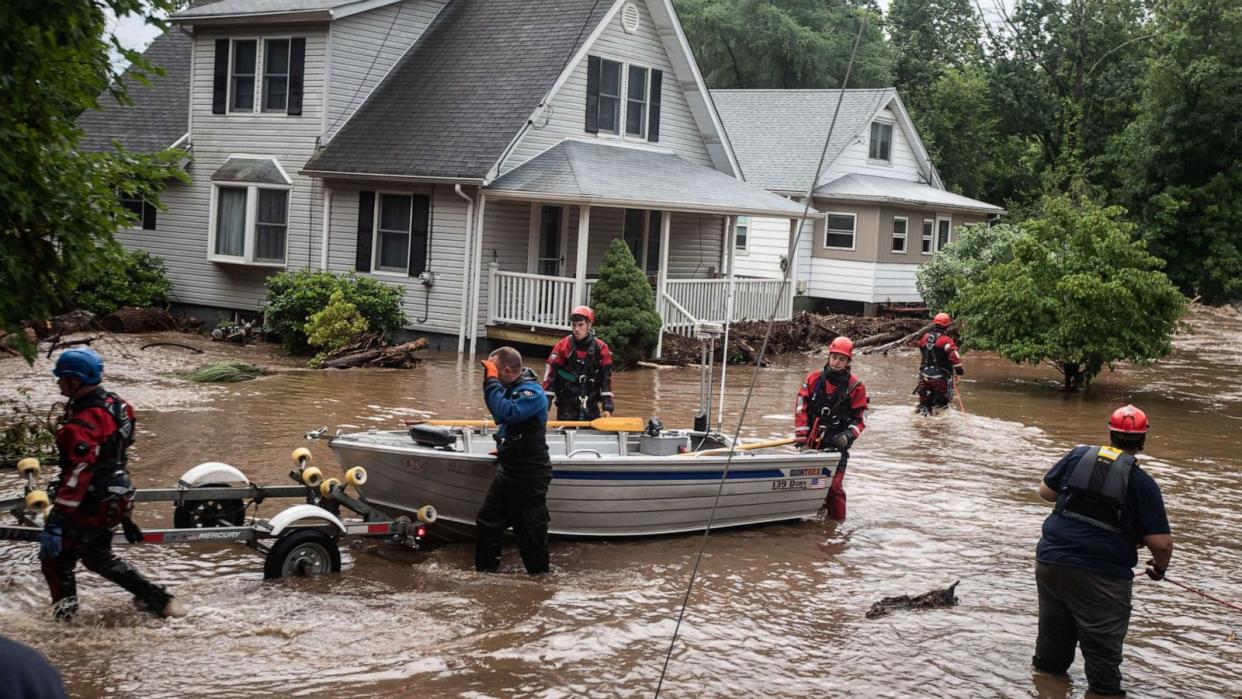 PHOTO: Emergency personnel used a boat to rescue residents of flooded homes on Lowland Hill Rd. in Stony Point New York, July 9, 2023. (Seth Harrison/The Journal News/USA Today)