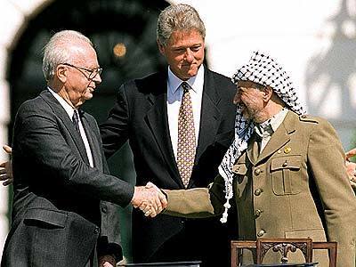 President Clinton with Arafat and Israeli Premier Yitzhak Rabin at the White House after the two signed a peace accord in 1993. Within months Arafat returned to the Gaza Strip for the first time in 30 years.