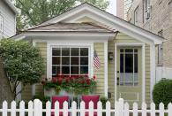 <p>It's hard to believe this cute-as-a-button 780-square-foot historic cottage sits in the middle of a bustling metropolis. The house, owned by David Hawkanson, the executive director of Chicago's <a href="https://www.steppenwolf.org/" rel="nofollow noopener" target="_blank" data-ylk="slk:Steppenwolf Theater Company;elm:context_link;itc:0;sec:content-canvas" class="link ">Steppenwolf Theater Company</a>, was built a few years after the Great Chicago Fire of 1871, when the Chicago Relief and Aid Society began offering so-called fire-relief cottage kits that included pre-cut wood, a door, a chimney, and a room partition. While historians believe more of these tiny cottages exist in Chicago, all but a couple of examples (like Hawkanson's) have become unrecognizable thanks to extensive renovations over the years.</p><p><a class="link " href="https://www.countryliving.com/home-design/house-tours/a5782/tiny-chicago-cottage-new-york-times/" rel="nofollow noopener" target="_blank" data-ylk="slk:SEE INSIDE;elm:context_link;itc:0;sec:content-canvas">SEE INSIDE</a></p>