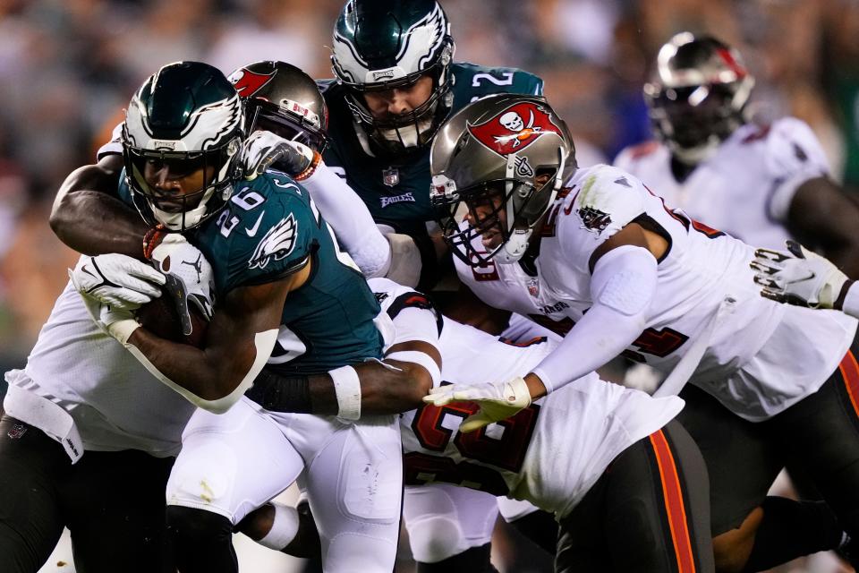 Philadelphia Eagles running back Miles Sanders (26) is tackled by the Tampa Bay Buccaneers during the second half of an NFL football game Thursday, Oct. 14, 2021, in Philadelphia. (AP Photo/Matt Slocum)