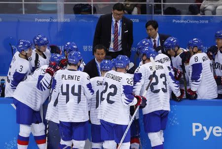 Ice Hockey – Pyeongchang 2018 Winter Olympics – Men Preliminary Round Match – Czech Republic v South Korea - Gangneung Hockey Centre, Gangneung, South Korea – February 15, 2018 - South Korean players confer with their coaches near the end of the game. REUTERS/Brian Snyder