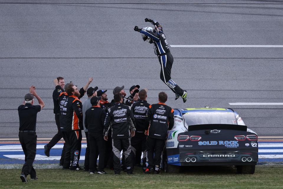 Jeb Burton and crew celebrate his win in the NASCAR Xfinity Series AG-Pro 300 at Talladega Superspeedway on April 22, 2023, in Talladega, Alabama.