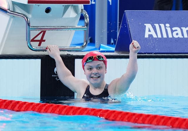 Maisie Summers-Newton celebrates in the pool