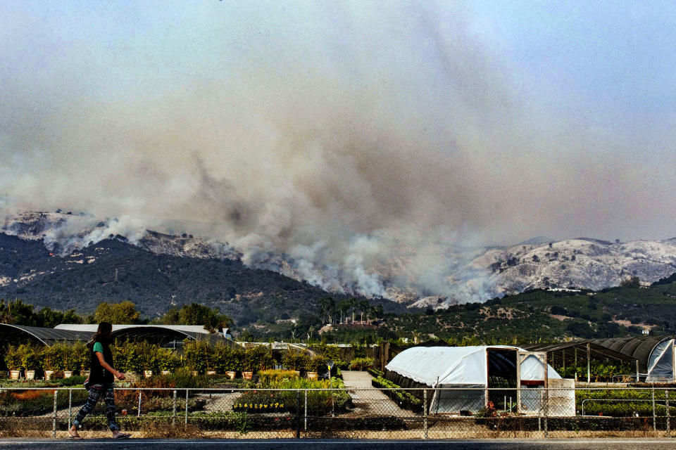 Wildfires in Southern California force thousands to flee