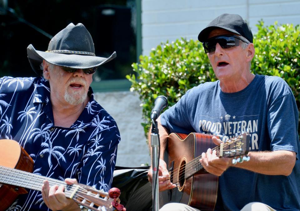 David Carr, right, sings Hank Williams Jr.'s "Old Habits" with his 1980s bandmate, Dallas Monninger, on Friday at the Washington County Day Reporting Center's first graduation ceremony.