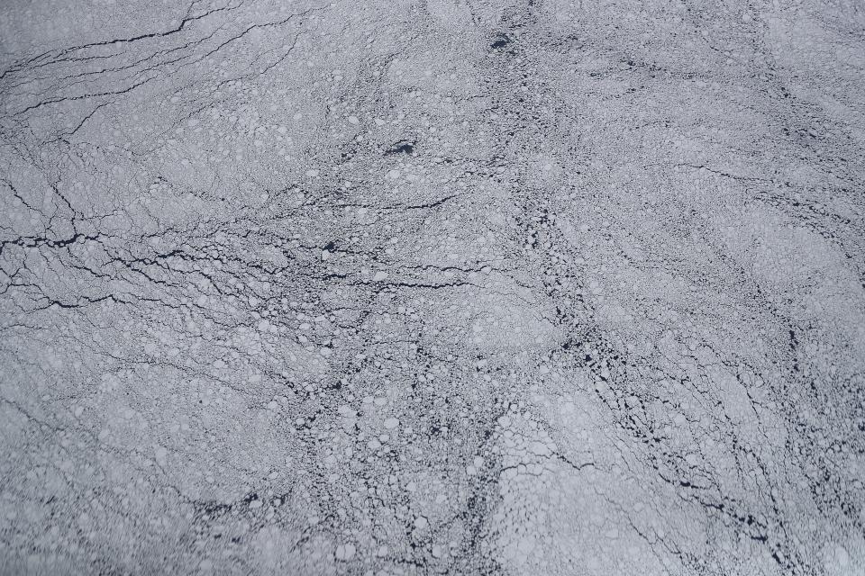 <p>Sea ice floes, as seen from NASA’s Operation IceBridge research aircraft, off the coast of the Antarctic Peninsula region on Nov. 3, 2017, above Antarctica. (Photo: Mario Tama/Getty Images) </p>