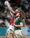 Canada's Evan Olmstead and South Africa's RG Snyman compete for lineout ball during the Rugby World Cup Pool B game at Kobe Misaki Stadium between South Africa and Canada in Kobe, Japan, Tuesday, Oct. 8, 2019. (Kyodo News via AP)