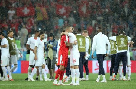 Soccer Football - World Cup - Group E - Serbia vs Switzerland - Kaliningrad Stadium, Kaliningrad, Russia - June 22, 2018 Serbia's Aleksandar Kolarov hugs Switzerland's Josip Drmic after the match REUTERS/Mariana Bazo