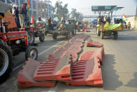 NEW DELHI, INDIA - JANUARY 26: Farmers proceeding into the capital from Ghazipur during a tractor rally on Republic Day on January 26, 2021 in New Delhi, India. Major scenes of chaos and mayhem at Delhi borders as groups of farmers allegedly broke barricades and police check posts and entered the national capital before permitted timings. Police used tear gas at Delhi's Mukarba Chowk to bring the groups under control. Clashes were also reported at ITO, Akshardham. Several rounds of talks between the government and protesting farmers have failed to resolve the impasse over the three farm laws. The kisan bodies, which have been protesting in the national capital for almost two months, demanding the repeal of three contentious farm laws have remained firm on their decision to hold a tractor rally on the occasion of Republic Day. (Photo by Sakib Ali/Hindustan Times via Getty Images)