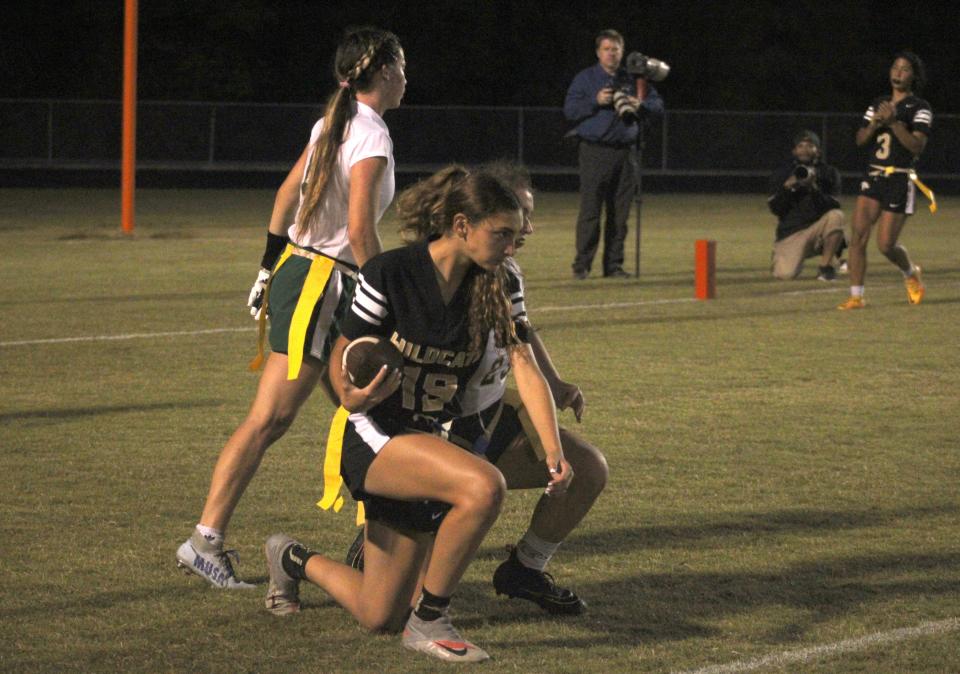 Davie Western wide receiver Lauren Holschauer (19) catches a second-quarter touchdown pass in front of Fleming Island's Mackenzie Kirk (23) in a Florida High School Athletic Association Class 2A flag football semifinal at Mandarin in Jacksonville on May 13, 2022. [Clayton Freeman/Florida Times-Union]