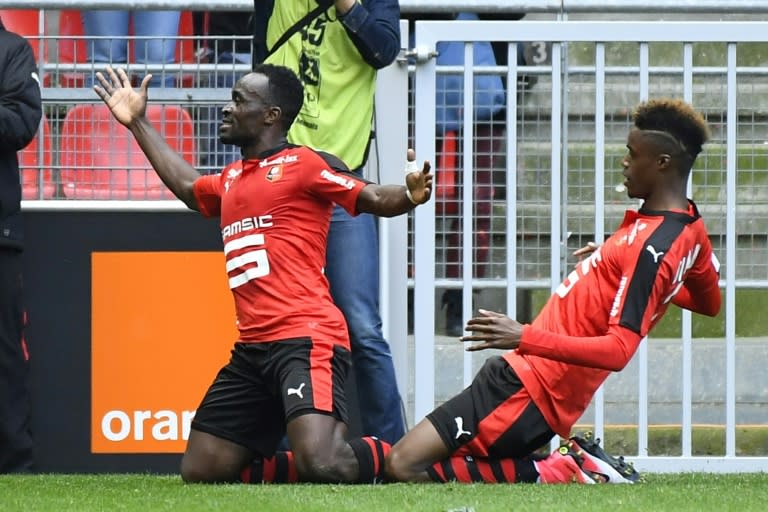 Rennes' forward Firmin Mubele (L) celebrates after scoring during a French L1 football match against Lyon at Roazhon Park stadium in Rennes on April 2, 2017