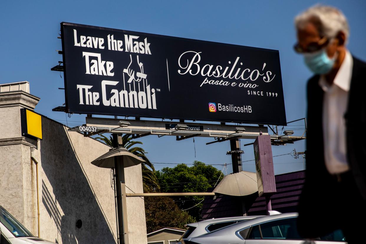 Huntington Beach restaurant Basilicos Pasta e Vino has put up an anti-mask billboard with a nod to the film "The Godfather."